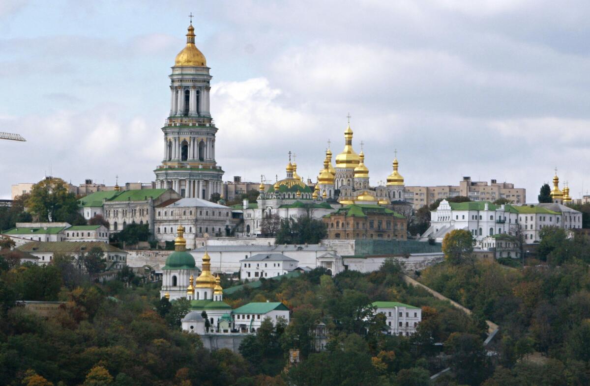 The Monastery of the Caves, surrounded by trees on a hilly portion of Kyiv 
