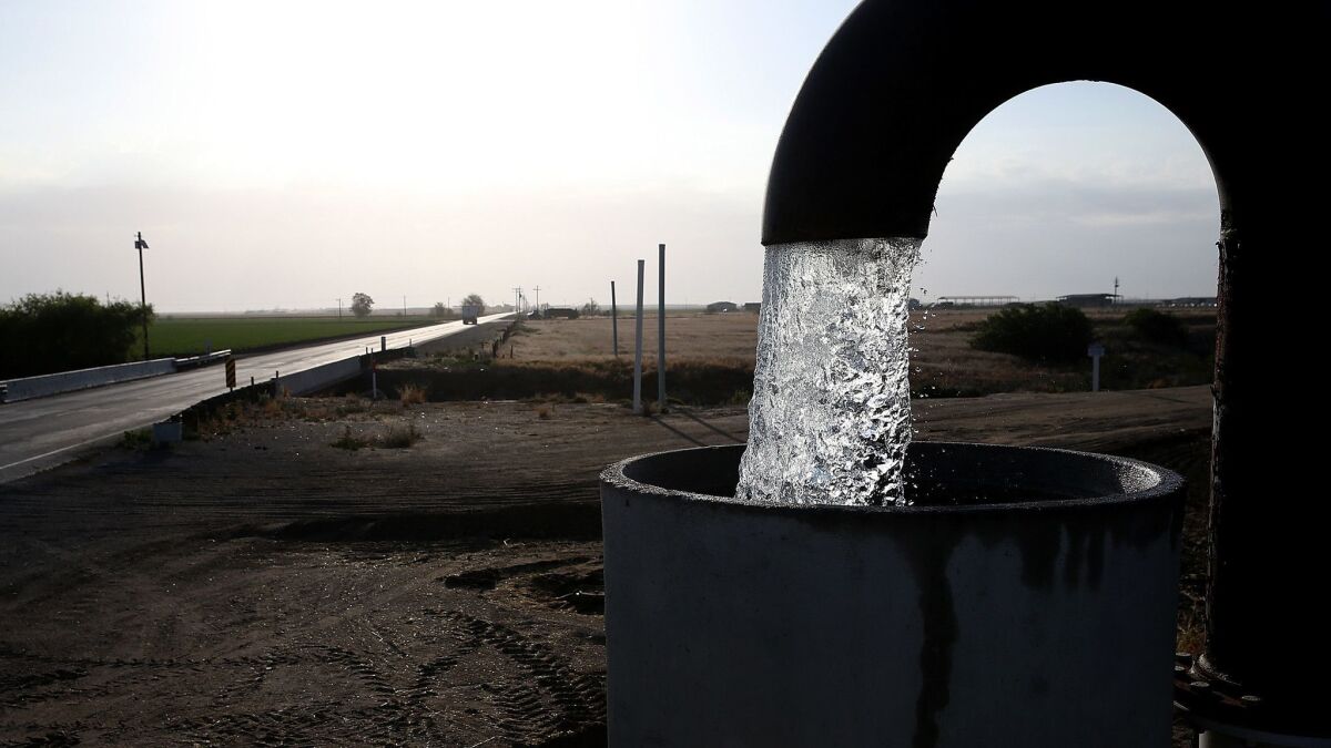 Well water is pumped from the ground in April 2015 in Tulare during the drought.