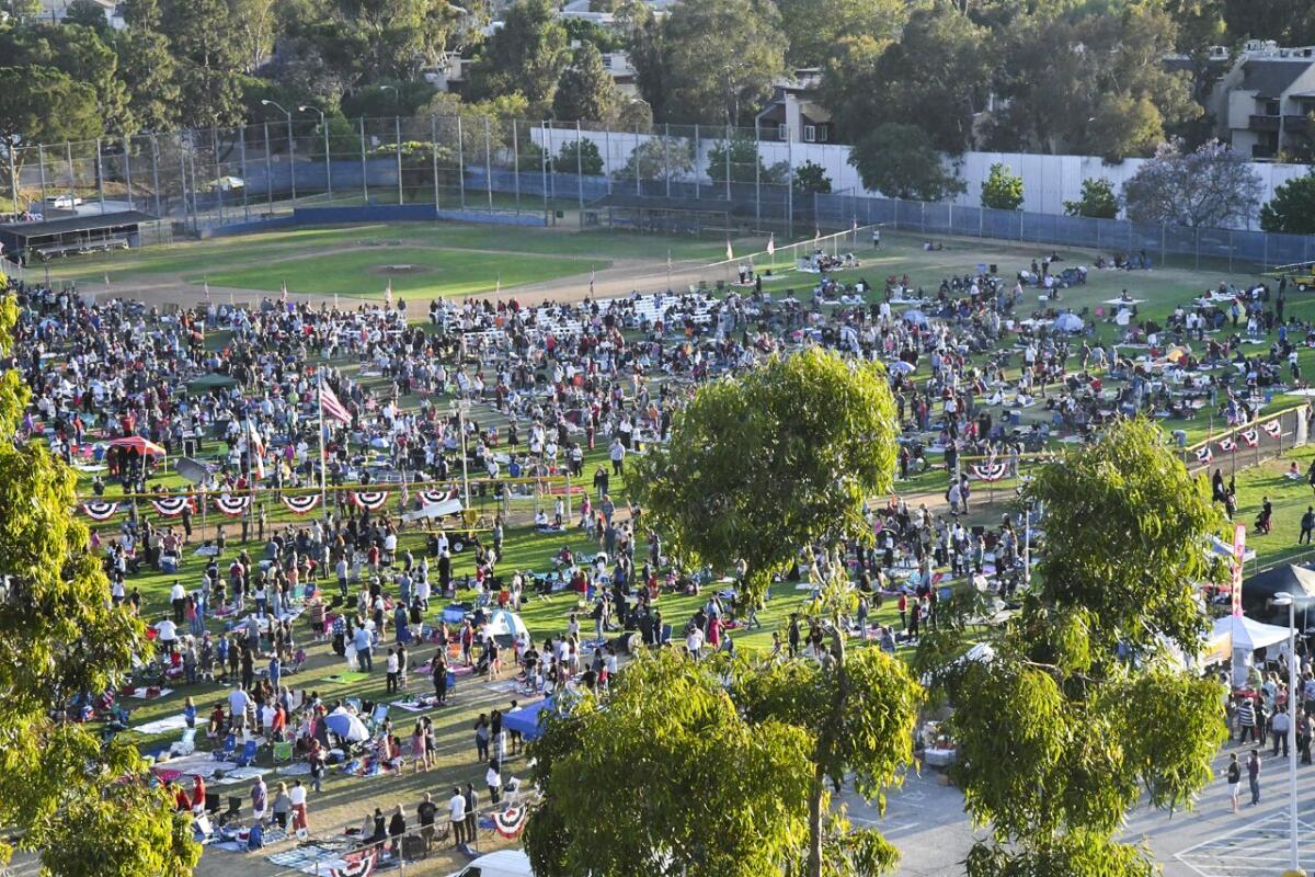 Visitors set up picnics at the West LA College campus for a Fourth of July celebration.