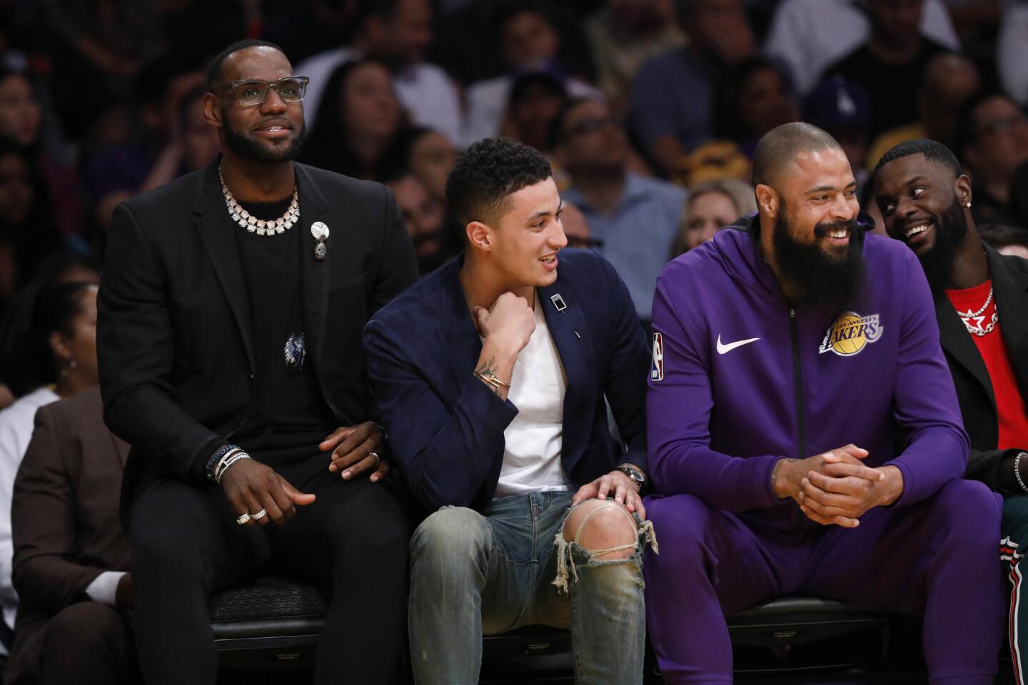 LeBron James, left, Kyle Kuzma, Tyson Chandler (5) and Josh Hart (3) of the Lakers.