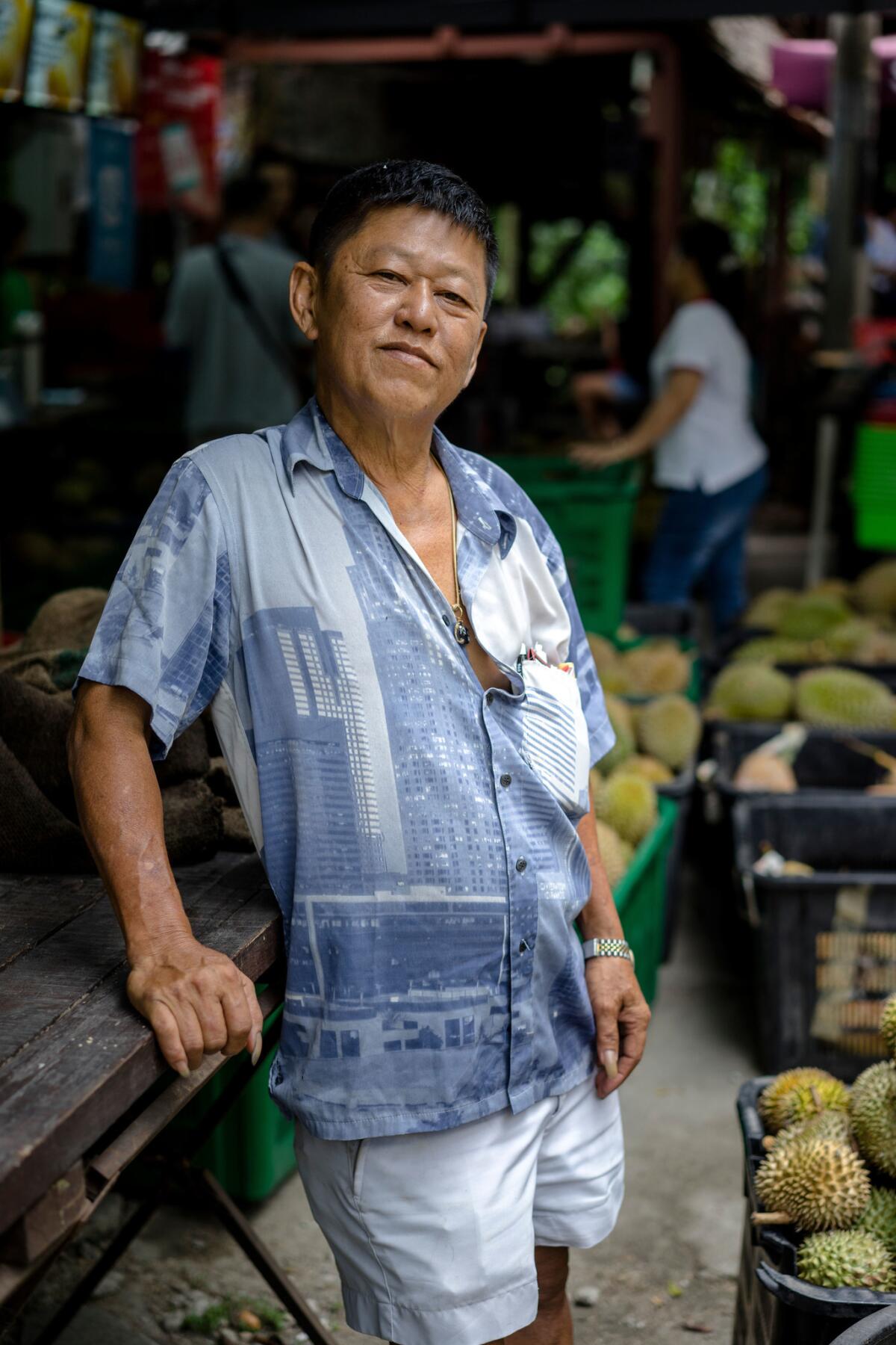 Tan Eow Chong at Durian Kaki, his roadside durian stall, in Bayan Lepas, Malaysia. (Suzanne Lee / For The Times)