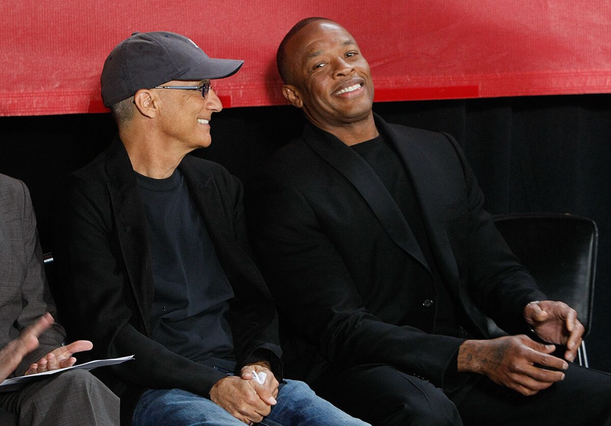 Music mogul Jimmy Iovine, left, and rapper Dr. Dre are all smiles during an announcement in Santa Monica in 2013 that they were giving $70 million to create the USC Jimmy Iovine and Andre Young Academy for Arts, Technology and the Business of Innovation.