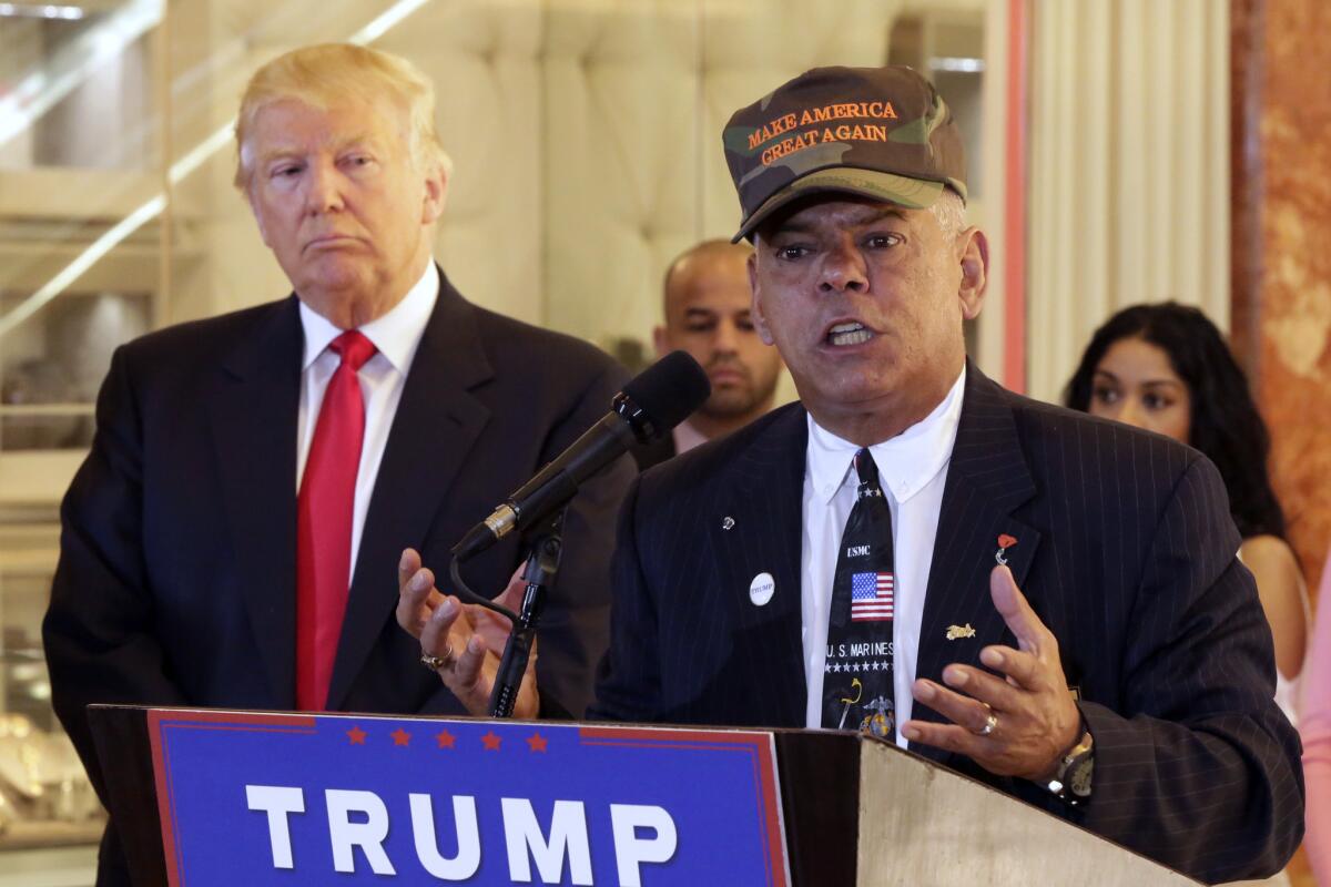 Al Baldasaro, right, a New Hampshire state representative who appeared often at Donald Trump events this year, told a radio interviewer Wednesday that "Hillary Clinton should be put in the firing line and shot for treason." (Richard Drew / Associated Press)