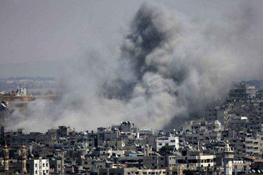 Smoke rises after Israeli airstrikes in the Shejaeiya neighborhood of eastern Gaza City.