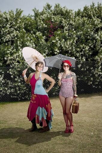 Sydney Gressel,28, left, and performance artist Spy Emerson, both from San Francisco, brought their sun protection on Day 2 of the Coachella Valley Arts and Music Festival, on the Empire Polo Club grounds in Indio.
