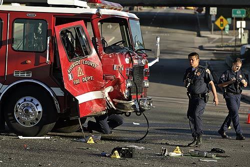 CHP officers investigate a fatal accident involving a Riverside County firetruck and a pickup truck at Etiwanda Avenue and Van Buren Boulevard in Mira Loma. The driver of the pickup was killed and two firefighters were injured.
