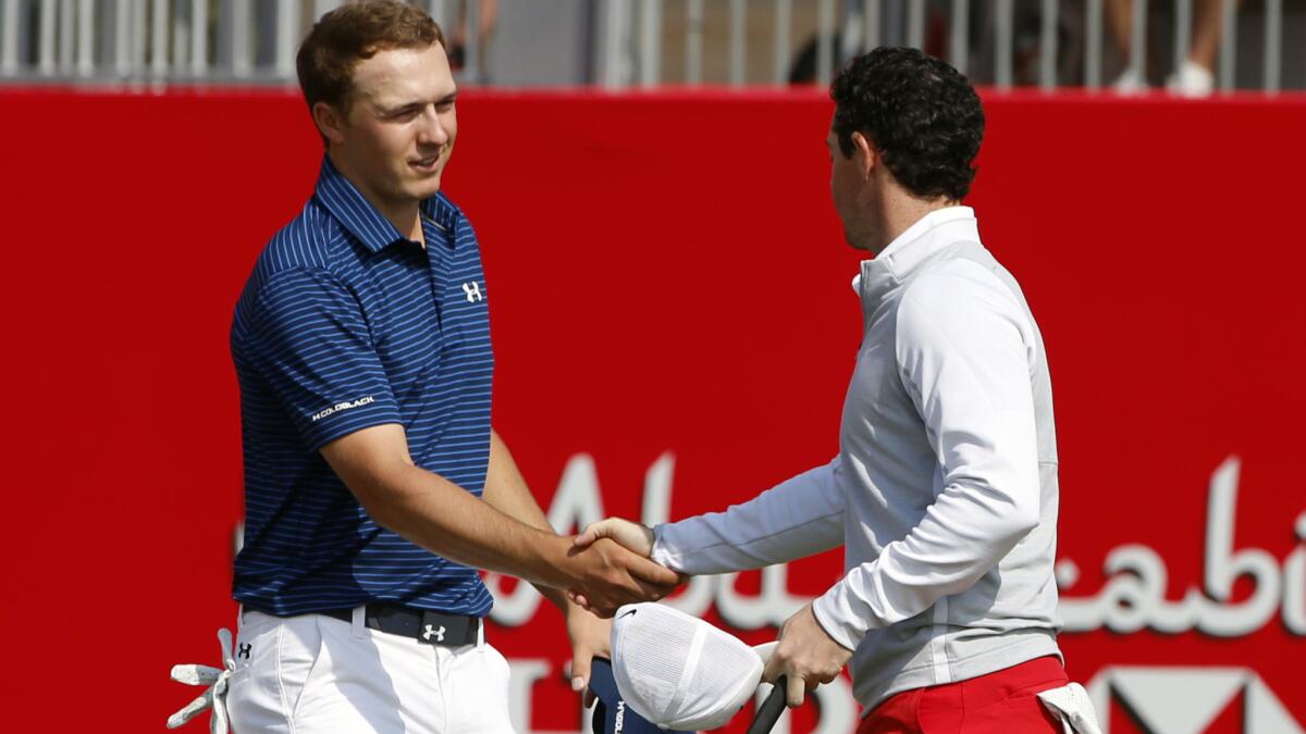 Jordan Spieth, left, and Rory McIlroy complete the third round of hte Abu Dhabi Golf Championship on Saturday.