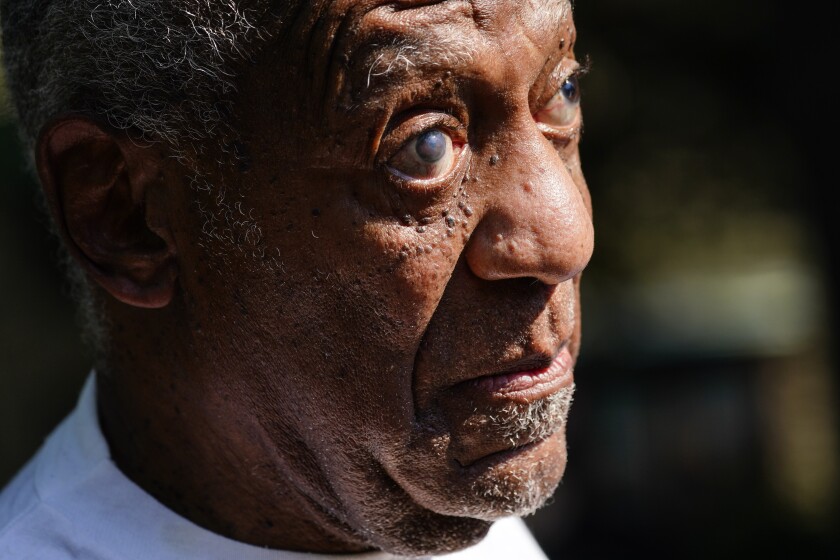 Bill Cosby reacts outside his home in Elkins Park, Pa., Wednesday, June 30, 2021, after being released from prison. Pennsylvania's highest court has overturned comedian Cosby's sex assault conviction. The court said Wednesday, that they found an agreement with a previous prosecutor prevented him from being charged in the case. The 83-year-old Cosby had served more than two years at the state prison near Philadelphia and was released.(AP Photo/Matt Rourke)