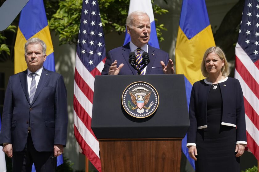 President Joe Biden accompanied by Swedish Prime Minister Magdalena Andersson and Finnish President Sauli Niinisto, speaks in the Rose Garden of the White House in Washington, Thursday, May 19, 2022. (AP Photo/Andrew Harnik)