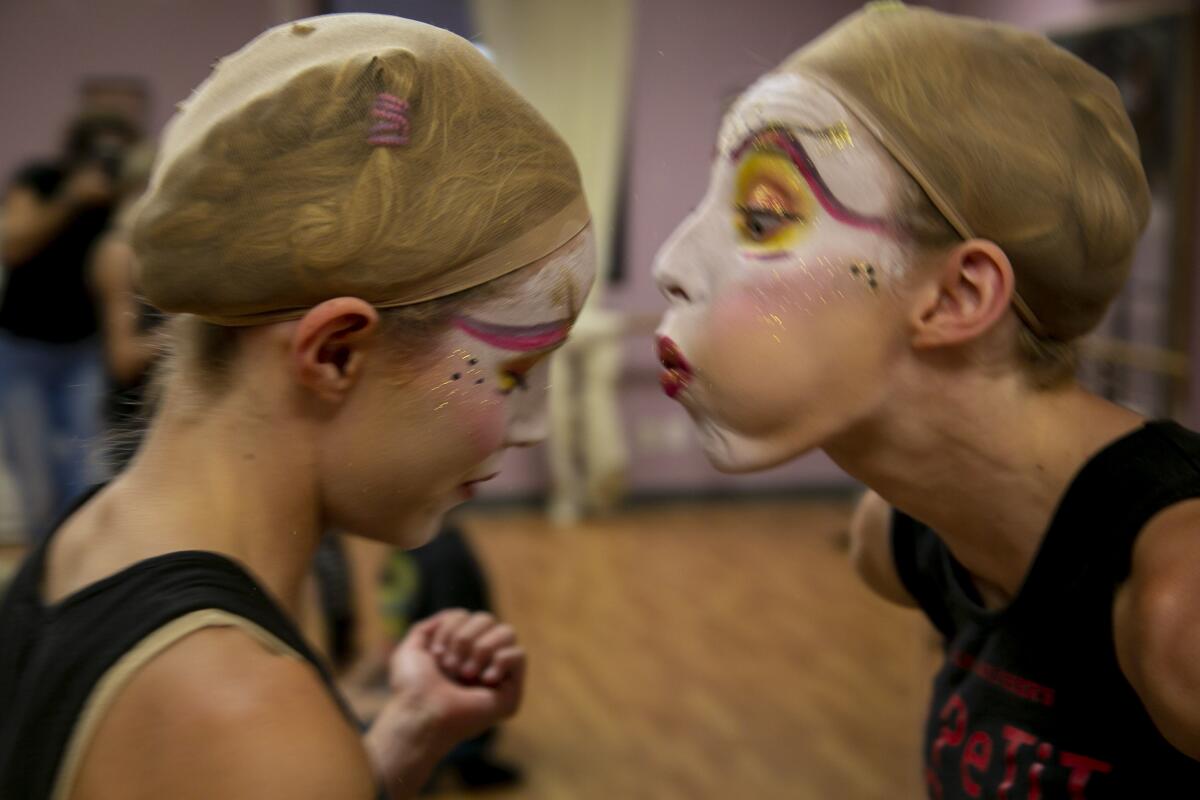 Brinkley, 15, blows glitter off twin sister Brooklyn Baker's face at Le PeTiT CiRqUe Aug. 29, 2020