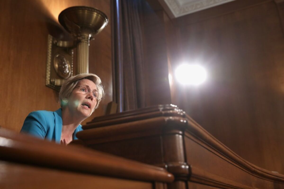 Sen. Elizabeth Warren is aiming her fire at the regulators who gave JPMorgan a pass.
