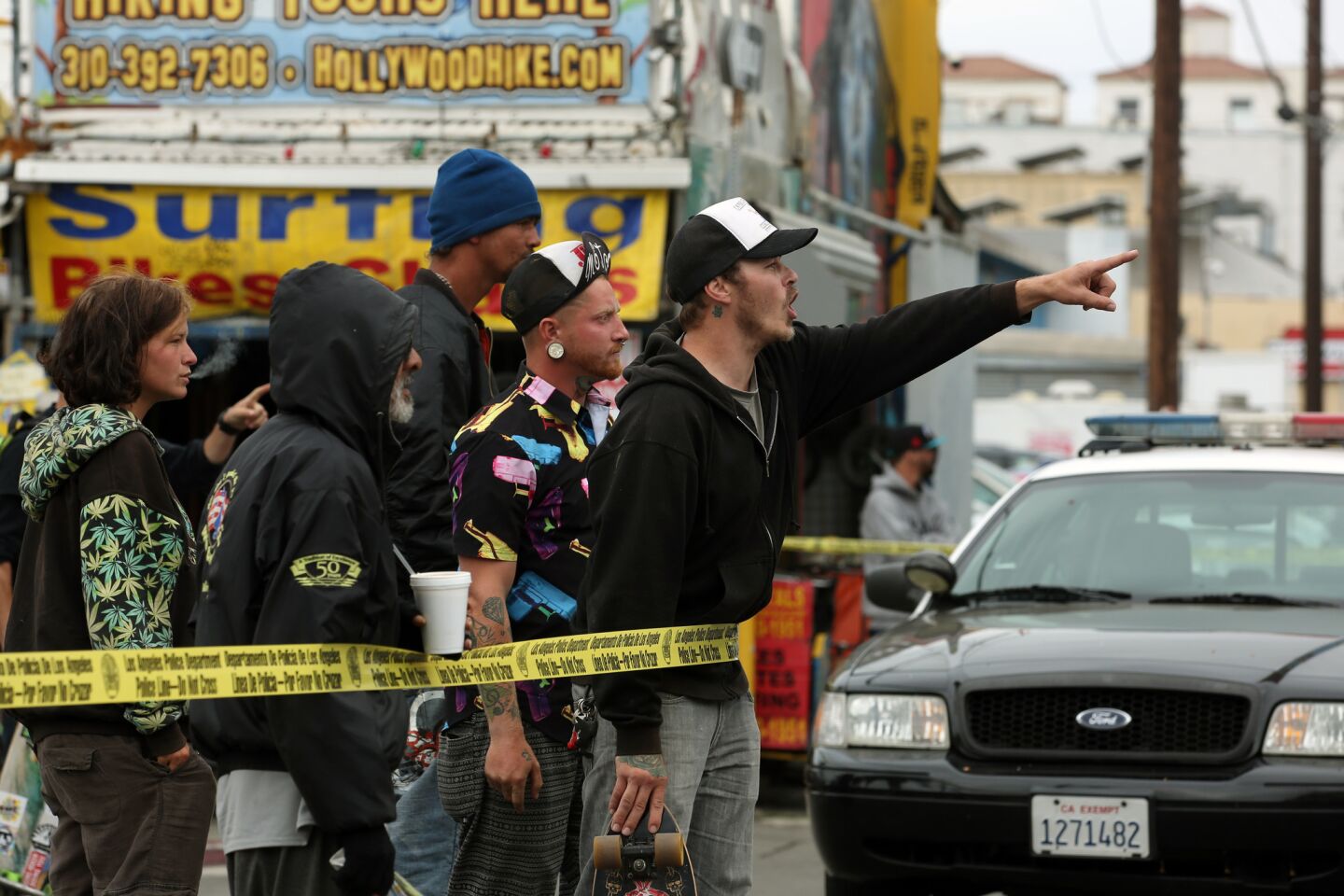Protesters shout at police officers near the scene of the officer-involved shooting in Venice.