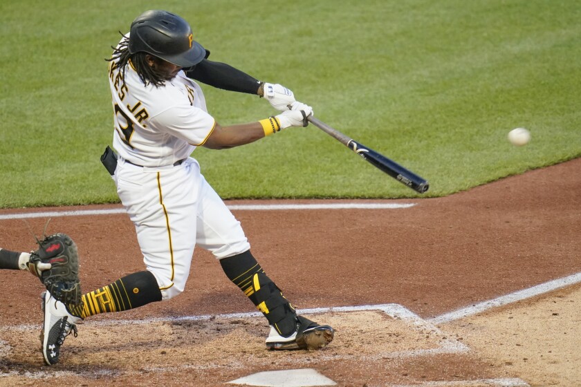 Pittsburgh Pirates' Troy Stokes Jr. drives in a run with a single against the Cincinnati Reds, his first hit in the majors, during the fourth inning of a baseball game Tuesday, May 11, 2021, in Pittsburgh. (AP Photo/Keith Srakocic)
