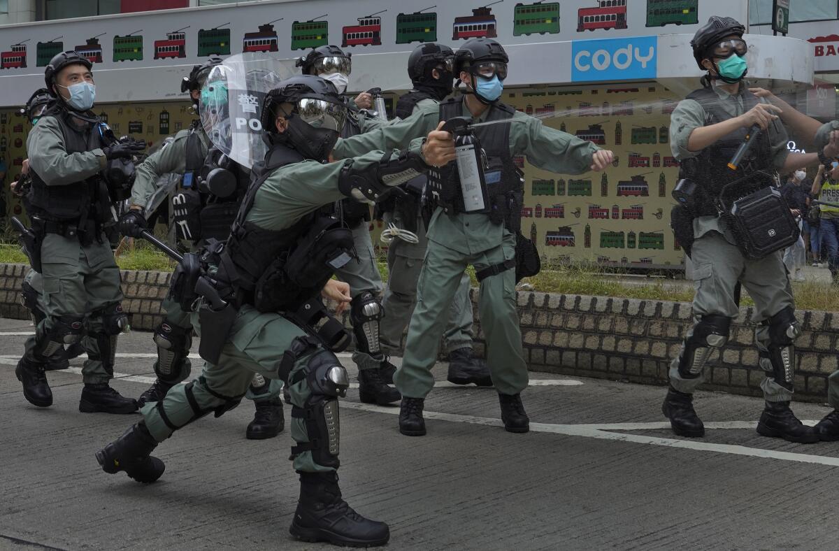 Riot police and protesters clash in a demonstration against Beijing's national security legislation May 24 in Hong Kong.