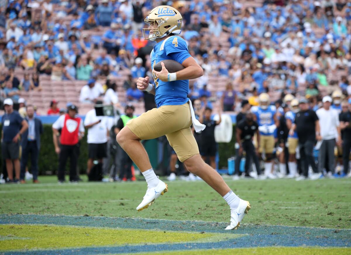 UCLA quarterback Ethan Garbers scores on a two-yard, second-quarter touchdown run against Alabama State.