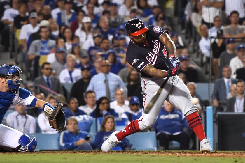 LOS ANGELES, CALIFORNIA OCTOBER 9, 2019-Nationals Howie Kendrick hits a grand slam agaisnt the Dodgers in the 10th inning in Game 5 of the NLDS at Dodger Stadium Wednesday. (Wally Skalij/Los Angeles Times)
