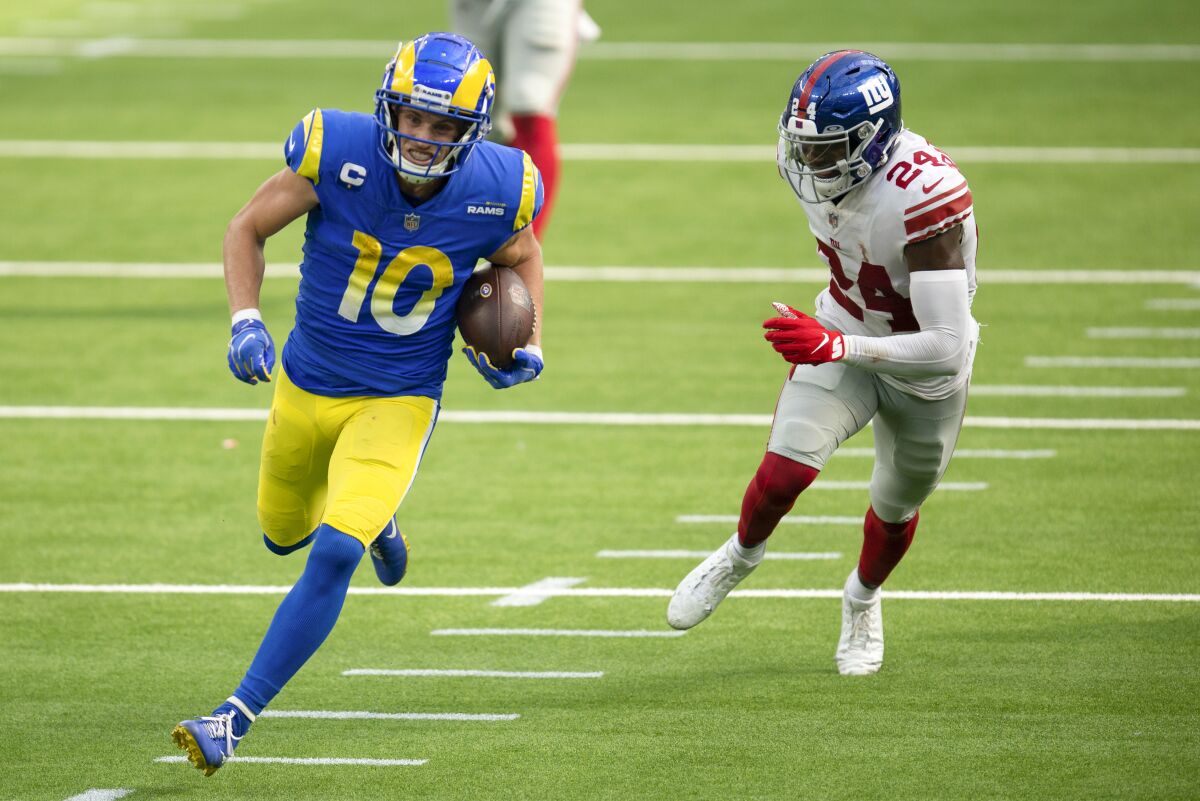 Rams wide receiver Cooper Kupp sprints for a touchdown past New York Giants cornerback James Bradberry