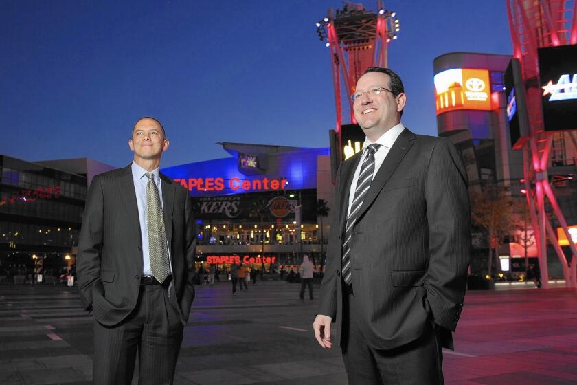 AEG executives Ted Fikre, left, and Dan Beckerman in downtown Los Angeles. AEG has signed off on the changes to remove it from the design process.