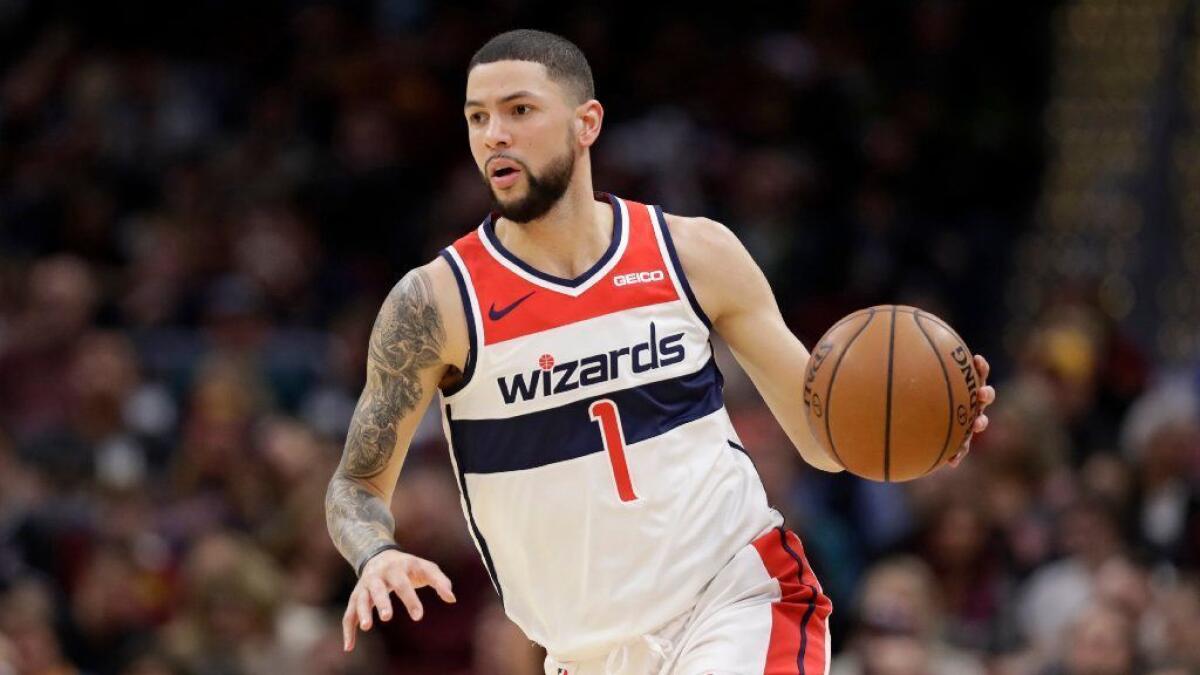 Washington Wizards' Austin Rivers drives to the basket in the second half of an NBA basketball game against the Cleveland Cavaliers on Dec. 8, 2018, in Cleveland.