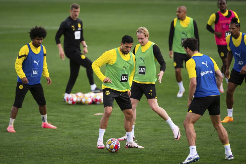 Borussia Dortmund's Emre Can, third from left, and Julian Brandt, fourth from left, attend a team training session in Cologne, Germany, Tuesday, May 28, 2024, ahead of their Champions League final against Real Madrid in London on Saturday. (Marius Becker/dpa (Marius Becker/dpa via AP)