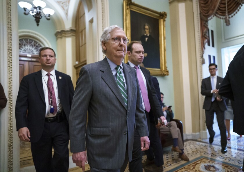 Senate Minority Leader Mitch McConnell, R-Ky., returns to the chamber after a news conference to criticize the Democrat push to pass a voting rights bill, at the Capitol in Washington, Thursday, June 17, 2021. (AP Photo/J. Scott Applewhite)