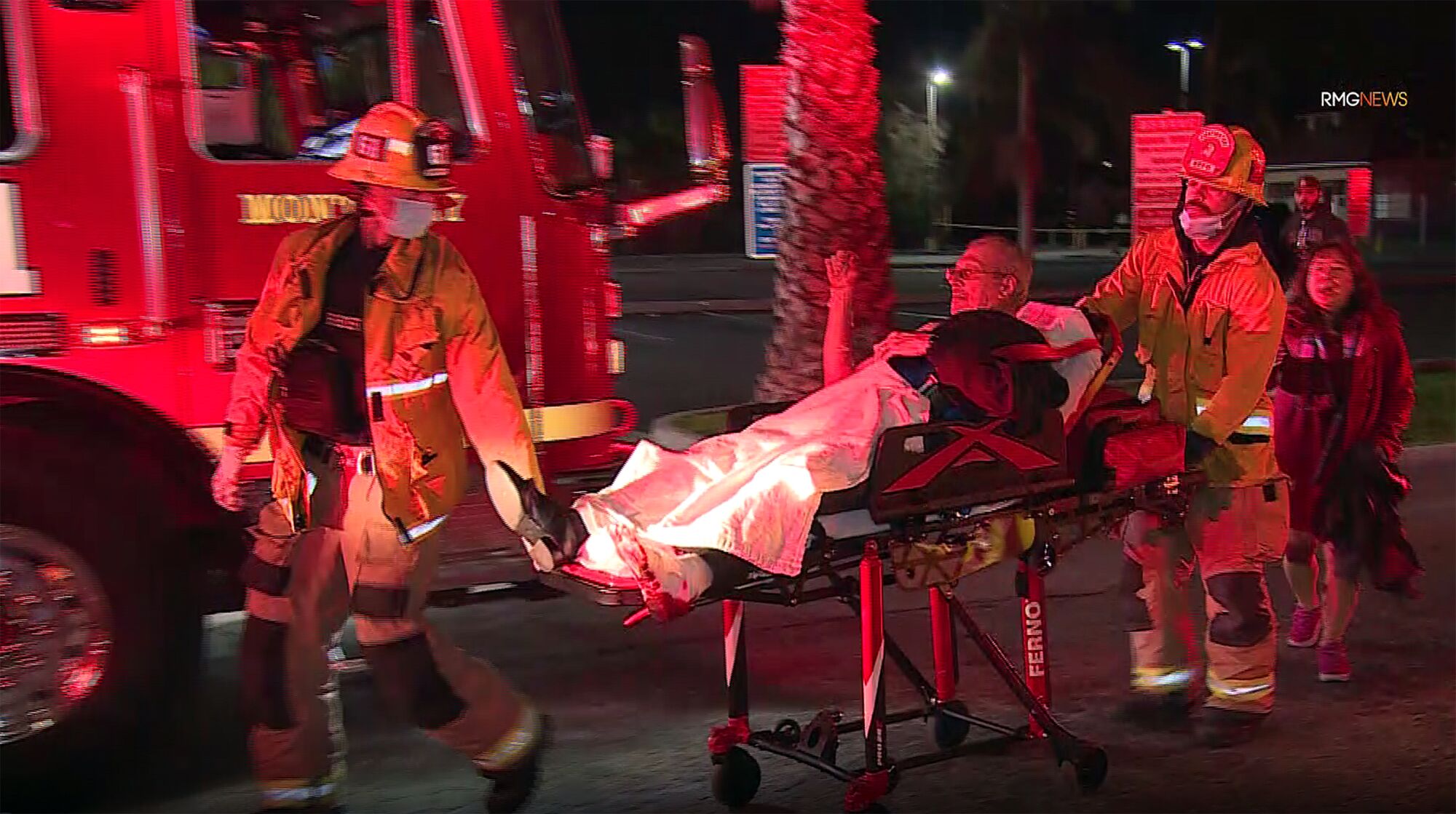 Firefighters attend to victims injured during a mass shooting.