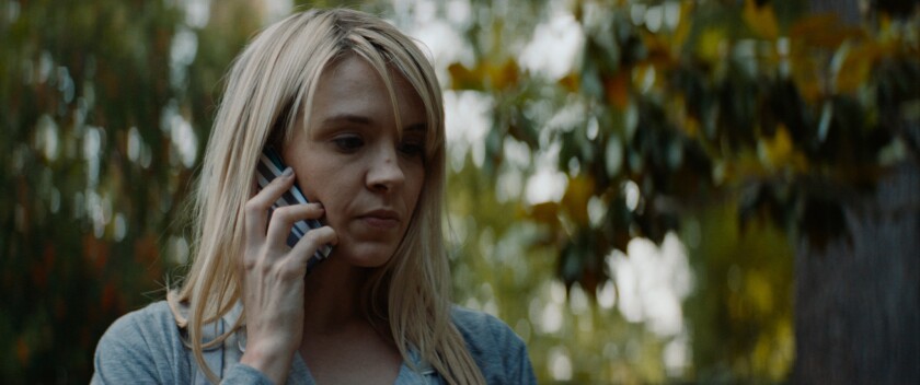 Brea Grant as a woman on her cell phone in the movie "Lucky."