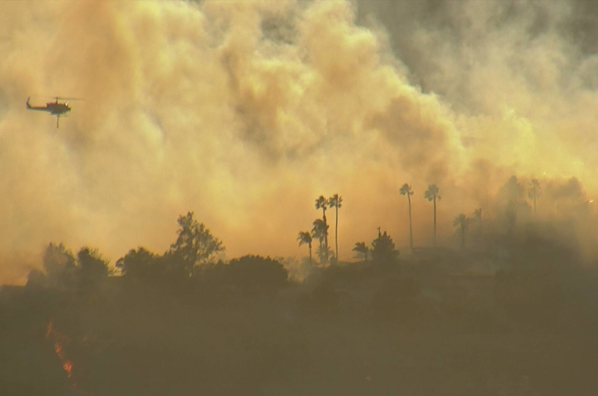 A fire burning in San Bernardino County is threatening structures.