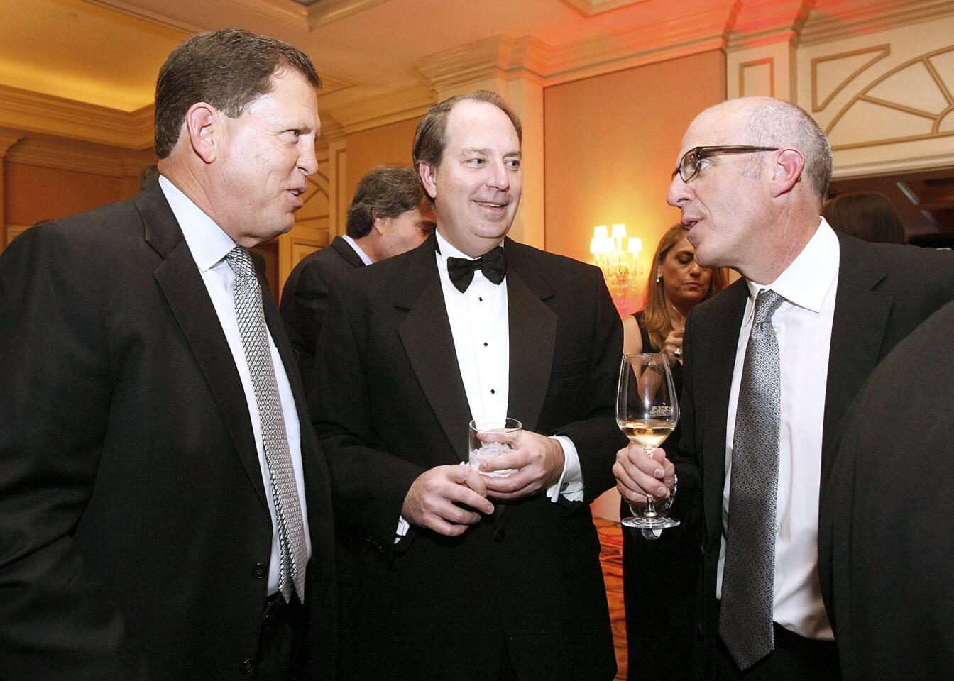 La Canada Flintridge mayor Stephen Del Guercio, center, talks with Chris Myers, left, and John Ricce, right, at the La Canada Flintridge Educational Foundation's Spring Gala at the Langham Huntington Hotel in Pasadena on Saturday, March 9, 2013. Del Guercio received the Spirit of Outstanding Service award at the event.