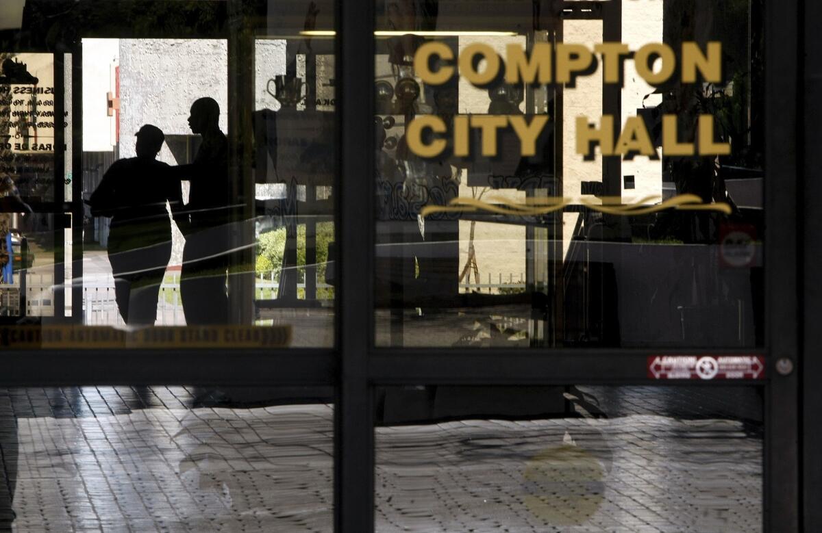 Visitors make their way into Compton City Hall in this 2012 photo.