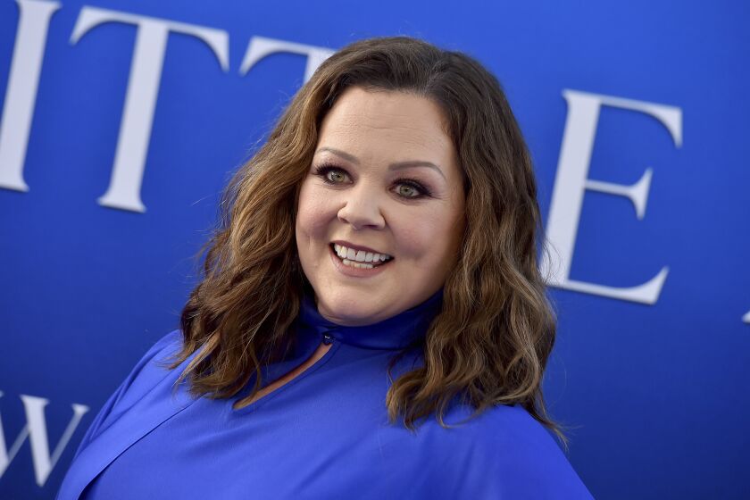 Melissa McCarthy smiles at a movie premiere