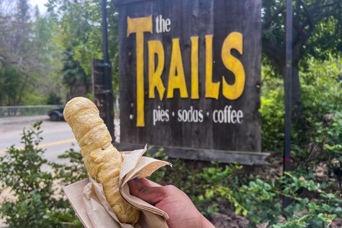 The snake dog, a beef hot dog wrapped in a flaky croissant crust, is one of the only non-vegetarian options at The Trails, a coffee, pastry and sandwich shop in Griffith Park.