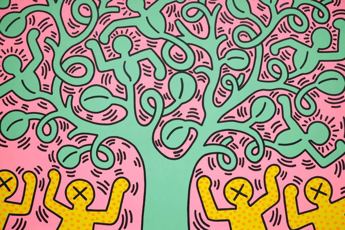  A detail of a cartoonish work by Keith Haring shows figures dancing under a green tree against a pink background.