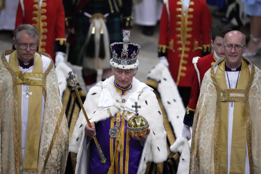 FILE - Britain's King Charles III, center, walks in the Coronation Procession after his coronation ceremony at Westminster Abbey in London, May 6, 2023. King Charles III is on the comeback trail. The 75-year-old British monarch will slowly ease back into public life after a three-month break to focus on his treatment and recuperation after he was diagnosed with an undisclosed type of cancer. (AP Photo/Kirsty Wigglesworth, Pool, File)