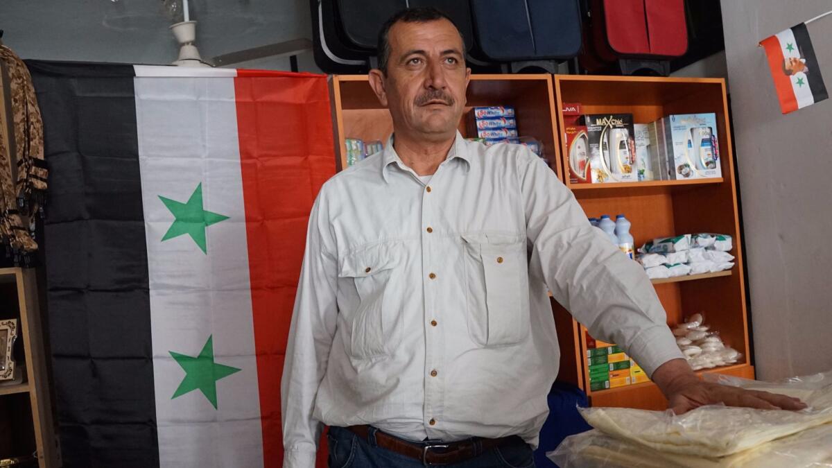 Issa Khateeb 50, at his shop in the Syrian city of Palmyra, is one of the few residents to return to the city that was largely abandoned when Islamic State took over.