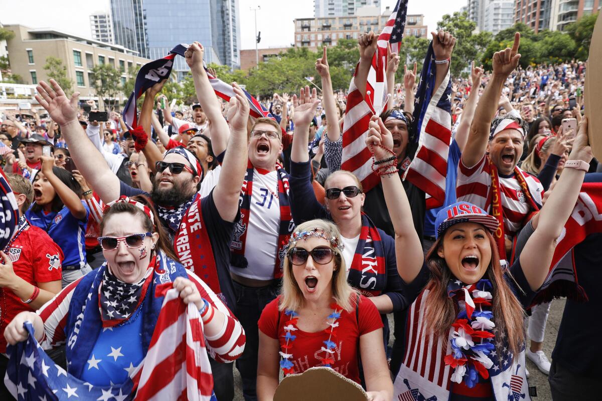 Several thousand soccer fans celebrate during a 2019 FIFA Women's World Cup Final Watch Party at Petco's Park at the Park on Sunday morning as the women's team won its fourth World Cup title in France. Pictured, left to right in the front row, are Lauryn Smith, Michelle Pekos and Aileen Burns.