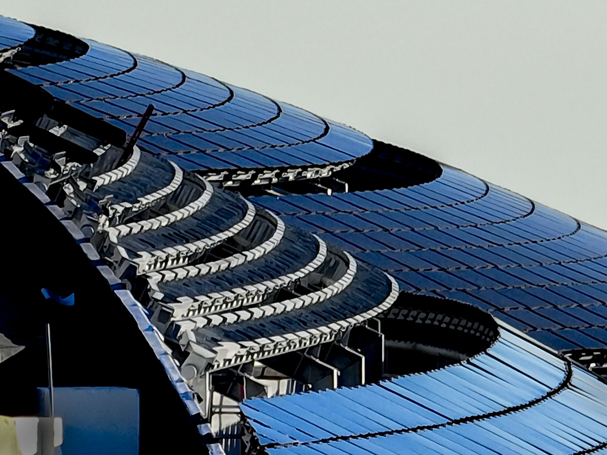 A view of solar panels on the roof of the Lucas Museum of Narrative Art under construction in Exposition Park.