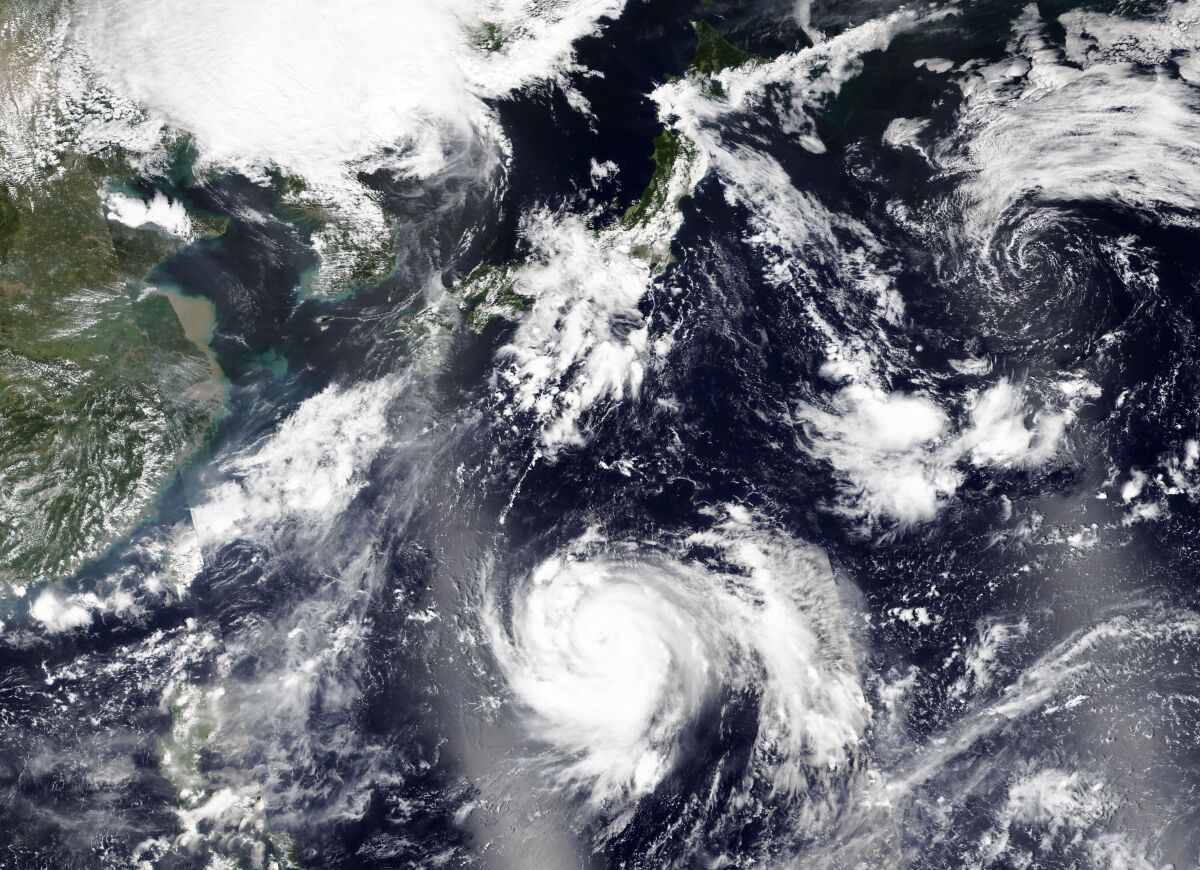 This Thursday, Sept. 3, 2020, satellite image released by NASA Worldview, Earth Observing System Data and Information System (EOSDIS) shows tropical storm Haishen, lower center, sweeping northward. Haishen could gain in ferocity before slamming into Japan's southern islands of Kyushu and Shikoku before reaching the Korean Peninsula on Monday. (NASA via AP)