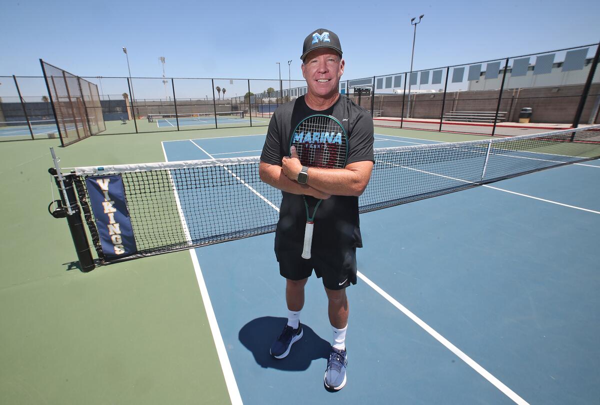 Chuck Kingman, Marina High tennis coach, at the school's courts.