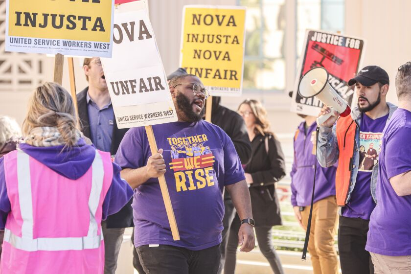 San Diego, CA - January 24: Janitors, from the United Service Workers Union who are on strike, rally outside the County Administrstion Building on Tuesday, Jan. 24, 2023 in San Diego, CA. (Eduardo Contreras / The San Diego Union-Tribune)