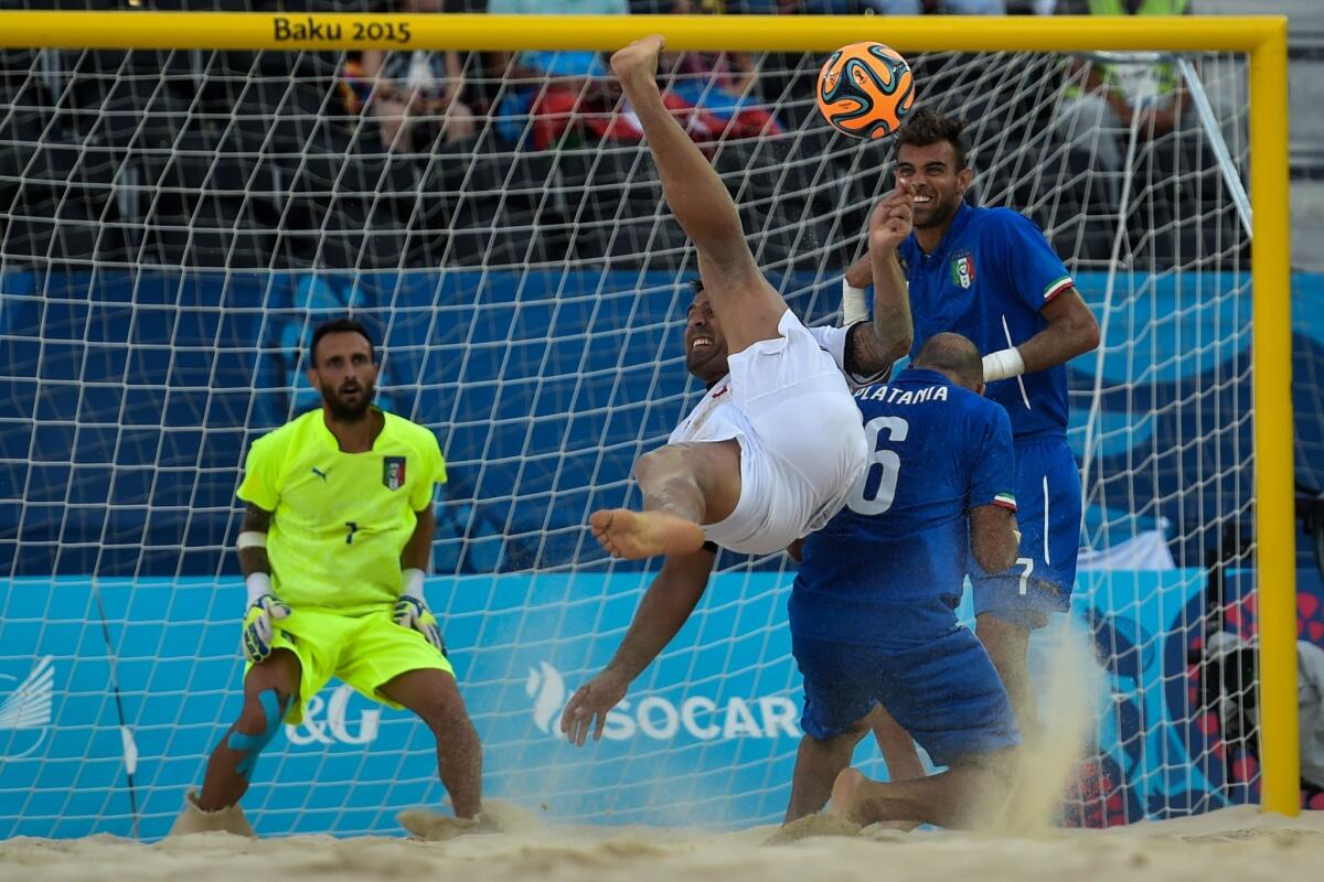 Switzerland's Dejan Stankovic (C) kicks the ball during the beach soccer men's semi-final match at the 2015 European Games in Baku on June 27, 2015. AFP PHOTO / KIRILL KUDRYAVTSEVKIRILL KUDRYAVTSEV/AFP/Getty Images ** OUTS - ELSENT, FPG - OUTS * NM, PH, VA if sourced by CT, LA or MoD **