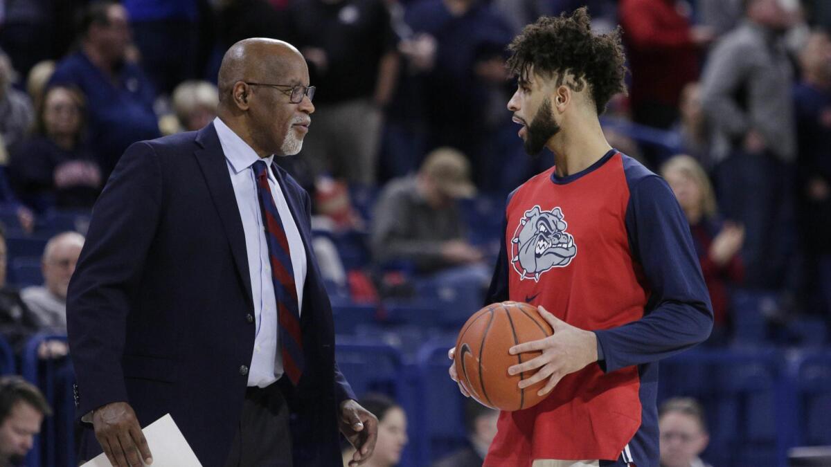 Gonzaga assistant coach Donny Daniels confers with guard Josh Perkins during halftime of a game against Pepperdine on Feb. 21.