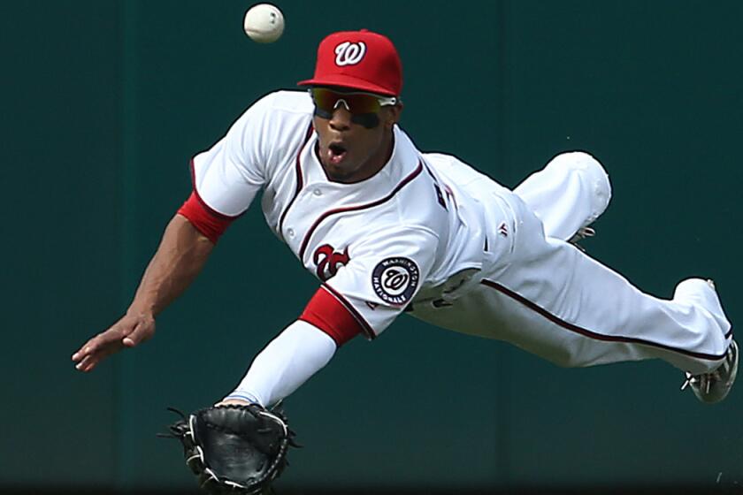 Ben Revere, then a member of the Washington Nationals, misses a catch against the Chicago Cubs on June 15.