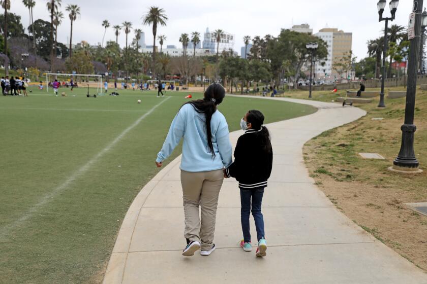 Ambar, 28, and her ten-year-old daughter at MacArthur Park in downtown on Tuesday, June 20, 2023 in Los Angeles.