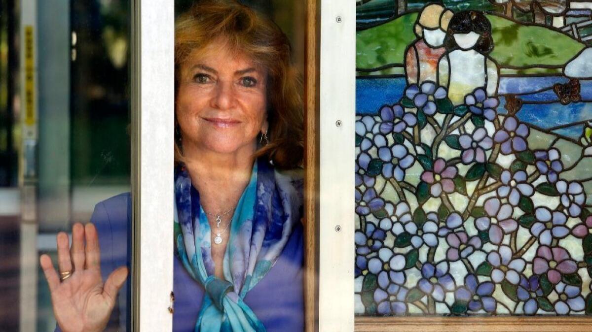 Dr. Yvonne Bryson, one of the foremost experts on pediatric AIDS, stands next to a stained-glass mural at the Marion Davies Children's Clinic at UCLA in Westwood.