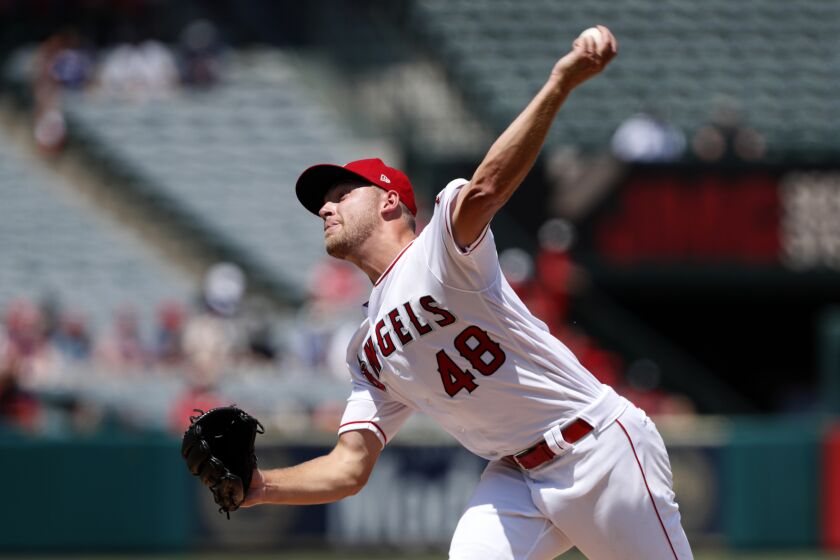 Los Angeles Angels starting pitcher Reid Detmers throws to a Houston Astros batter during the second inning of a baseball game in Anaheim, Calif., Sunday, Aug. 15, 2021. (AP Photo/Alex Gallardo)