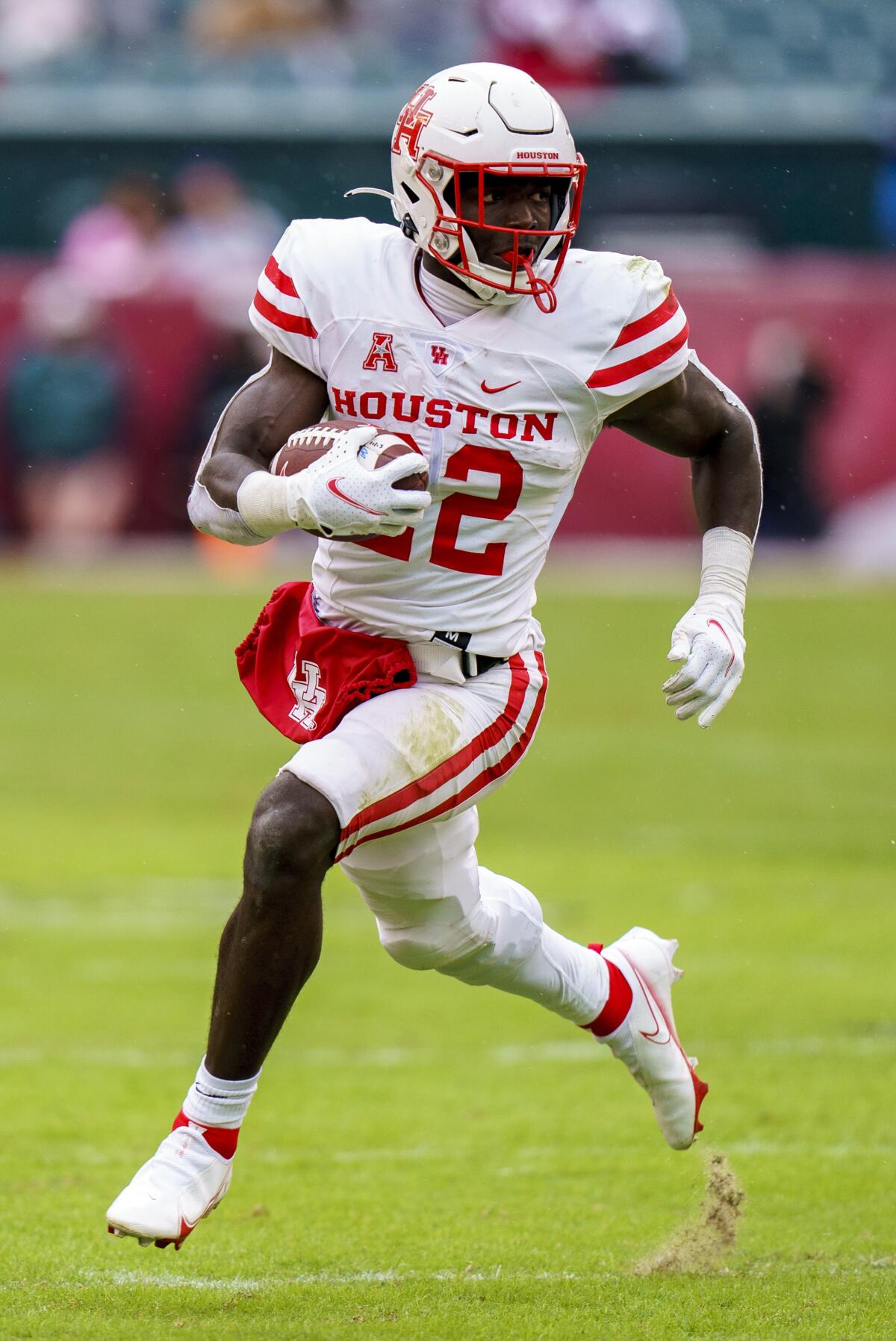 Houston running back Alton McCaskill (22) runs with the ball during the first half of an NCAA college football against Temple, Saturday, Nov. 13, 2021, in Philadelphia. (AP Photo/Chris Szagola)
