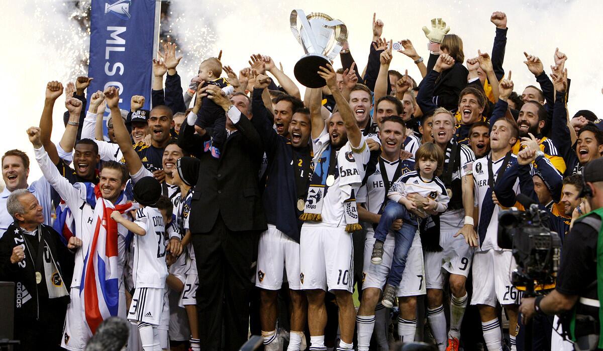 Galaxy players celebrate their win against the Houston Dynamo in the MLS championship at the Home Depot Center in 2011.
