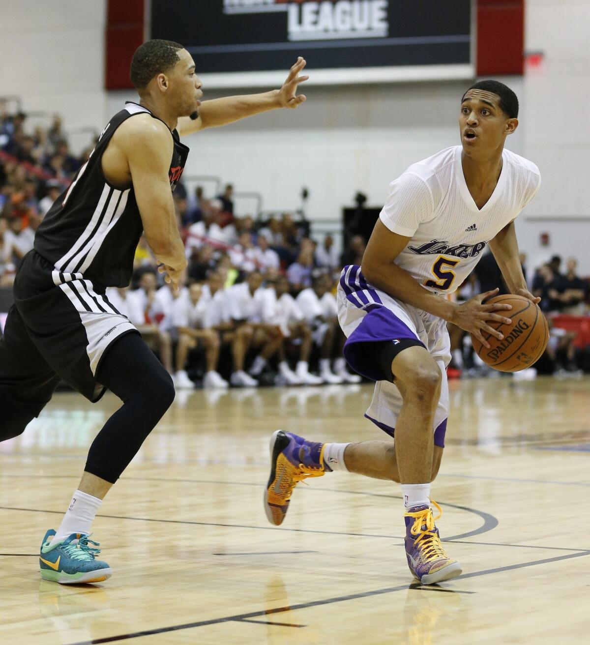 Jordan Clarkson, right, had 19 points, including the game-winning basket, in the Lakers' 89-88 win over the Golden State Warriors in a summer league game.