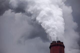 Vapor rises from a chimney at a coal powered power plant. Photographer: Bloomberg Creative Photos/Bloomberg Creative Collection